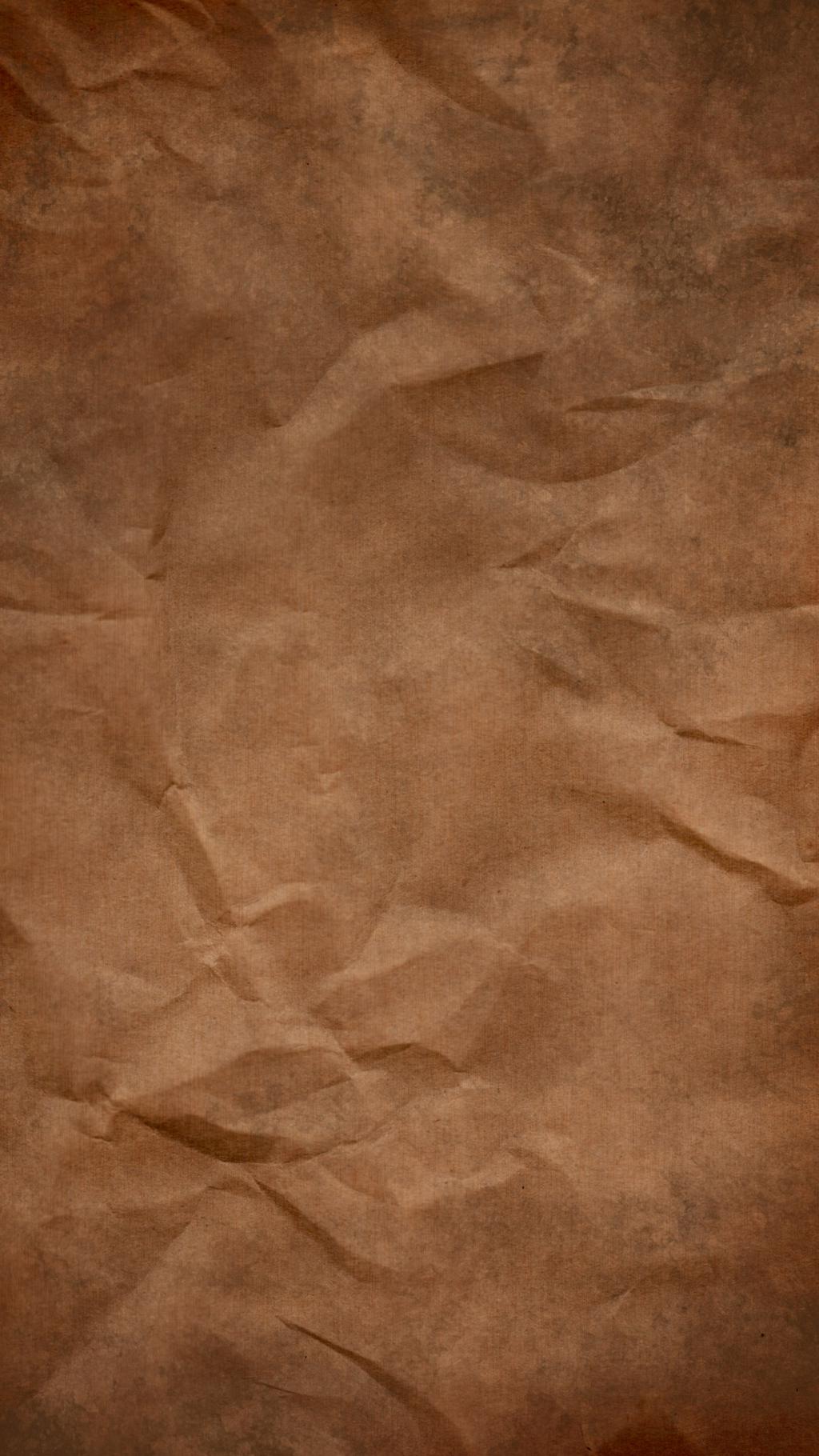 褶皱的纸张背景图